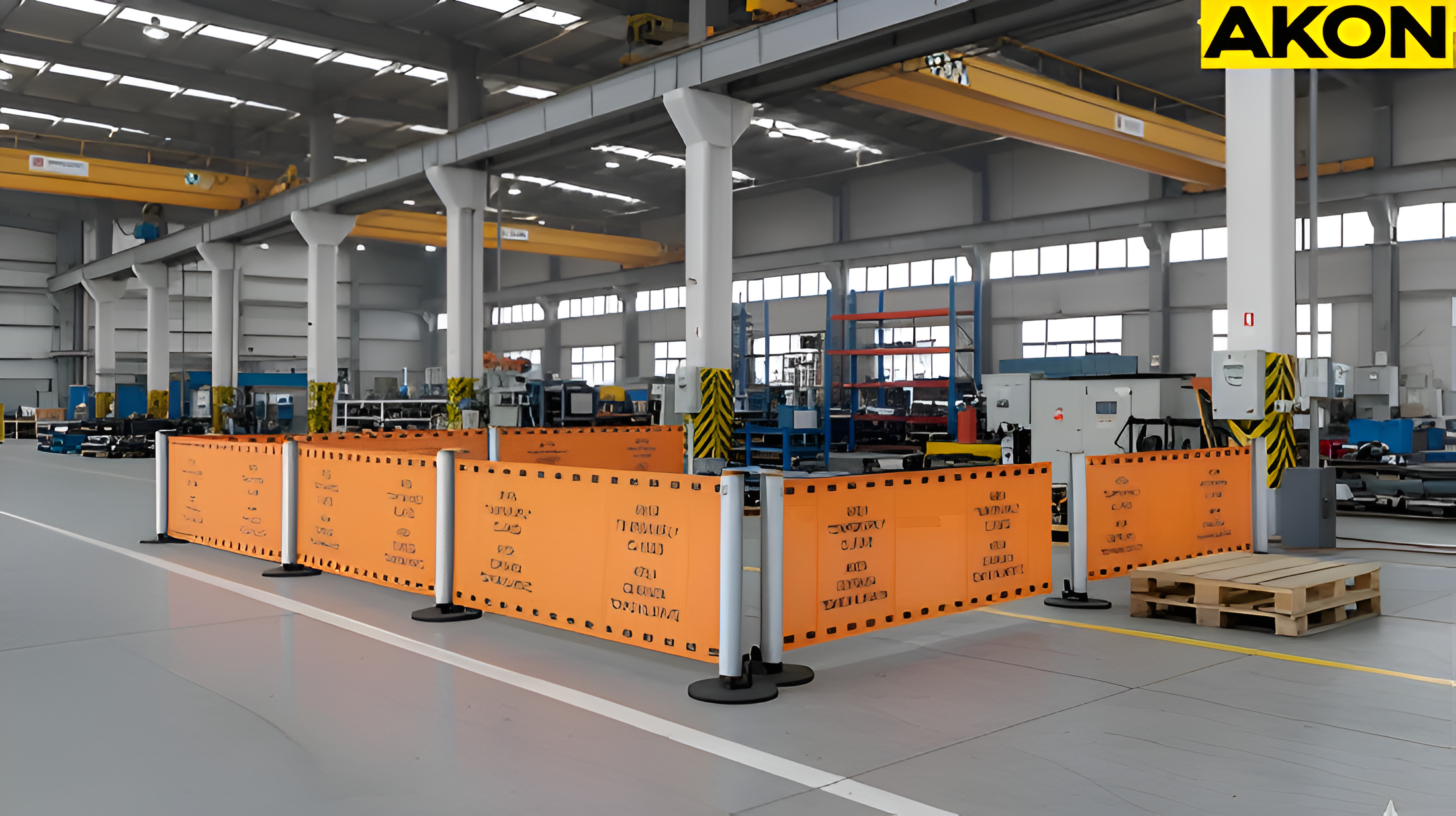 Industrial QA quarantine areas defined using orange retractable barrier panels inside manufacturing facilities