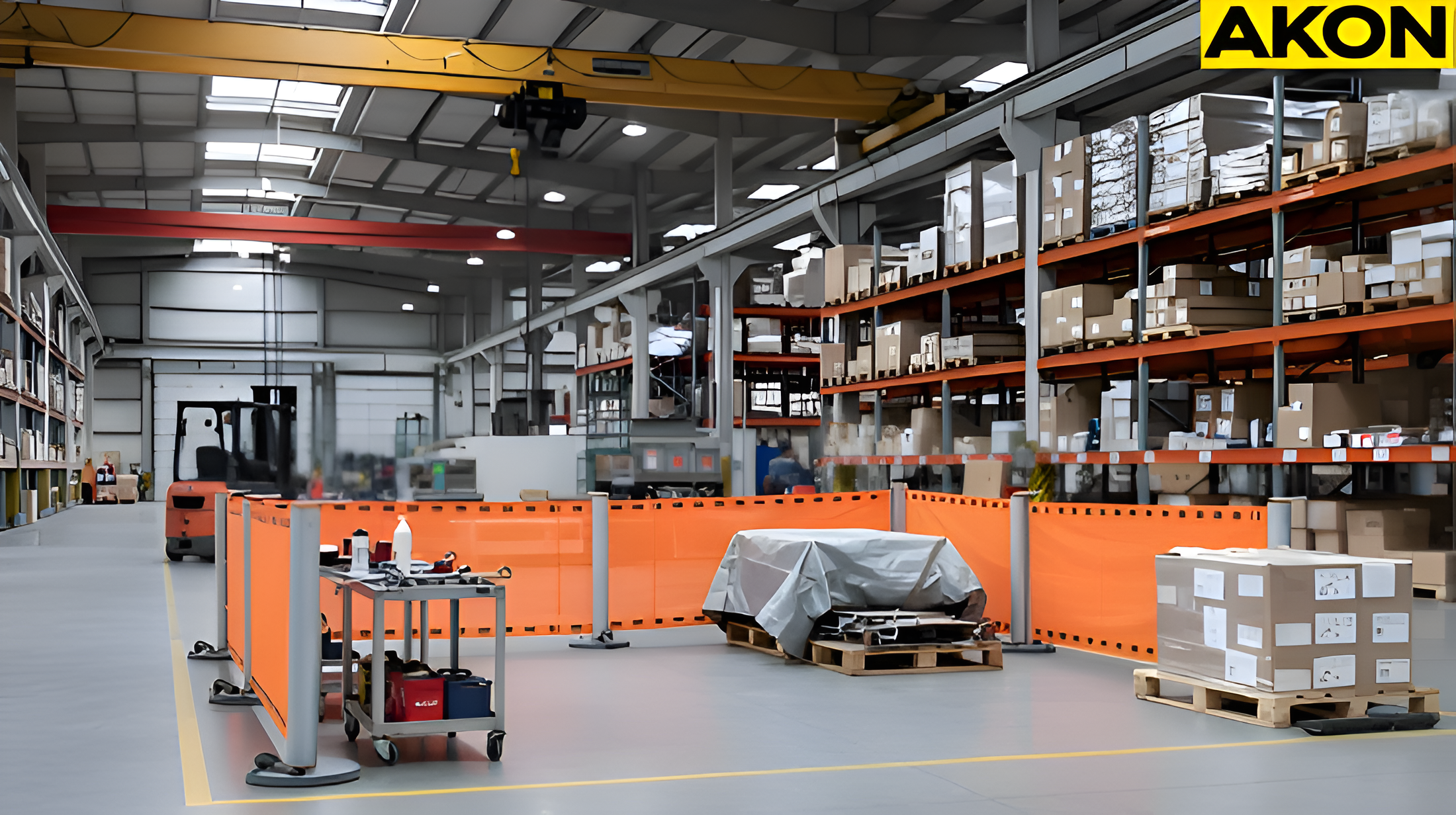 Portable industrial retractable barriers forming a controlled maintenance zone on a warehouse floor