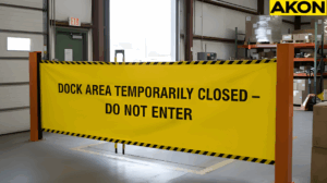 Retractable safety barriers blocking a warehouse docks area temporarily closed to foot traffics