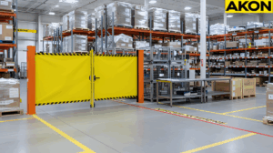 Warehouse QA hold zones secured with retractable safety barrier separating inspection area from active aisles